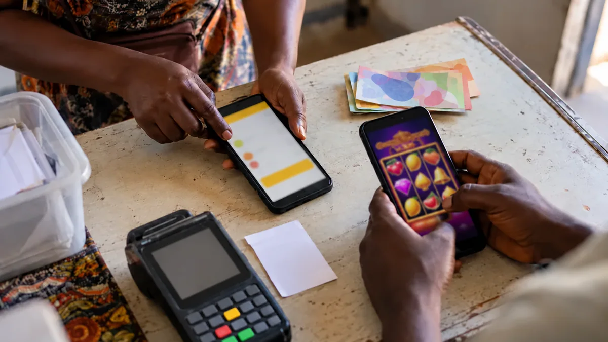 MTN wallet payment context beside a blurred betting phone.
