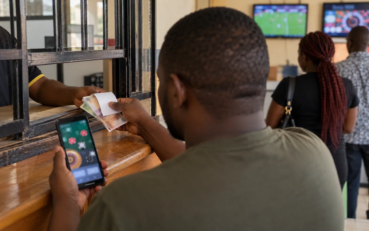 Payment terminal and betting-phone records at a Zambia counter.